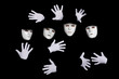 Team of young break dancers in masks on black backround