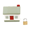 miniature house with lock isolated on white