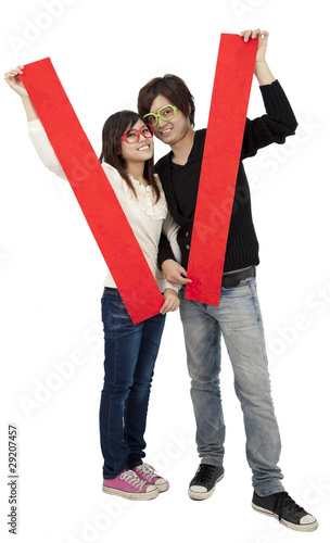 Photo: Happy Chinese new year. Young Asian couple showing Happy Chinese new year. Young Asian couple showing