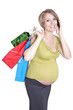 Photo: Happy pregnant woman shopping and speaking by phone Happy pregnant woman shopping and speaking by phone