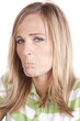 Woman in green and white sad