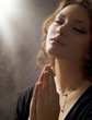 Praying Woman. Retro Styled. Soft focus