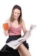 Photo: Girl with coffee and newspaper Girl with coffee and newspaper