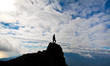Silhouette of woman on the top of the rock Silhouette of woman on the top of the rock