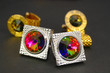 Two pairs bright cuff links on a dark background Two pairs bright cuff links on a dark background
