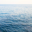 Calm sea extending to the horizon Calm sea extending to the horizon