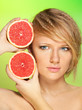 Portrait of  young attractive woman with grapefruit