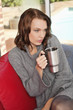 Young woman holding cup