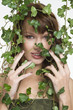 Woman with ivy covering her face