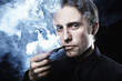 Photo: Artistic dark portrait of the young beautiful man. The young man Artistic dark portrait of the young beautiful man. The young man