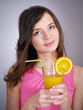 Foto: adorable girl with a glass of orange juice adorable girl with a glass of orange juice