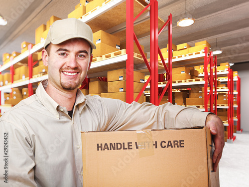 Photo: delivery man in warehouse delivery man in warehouse