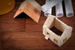 House with roof on wood background with copy space. House with roof on wood background with copy space.