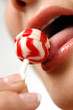 Foto: Girl licking a lollipop Girl licking a lollipop