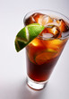 cold tea with lime and ice (close up) on gray background