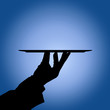 Waiter holding tray