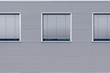 Building with metal panels and windows with persiennes Building with metal panels and windows with persiennes
