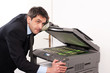 Businessman make false money on copy machine