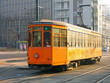 Old orange tram in Milan, Italy