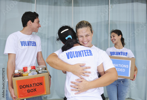 Photo: volunteer group with food donation boxes volunteer group with food donation boxes