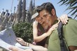 Young Couple Reading City Map