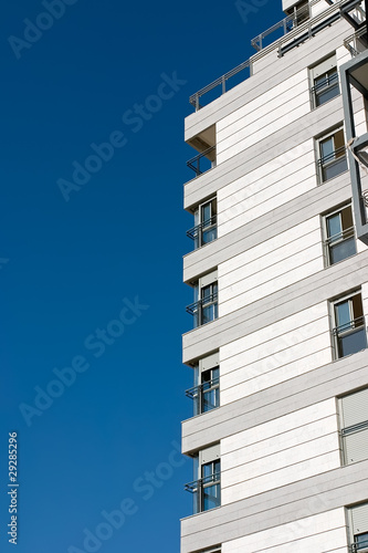 Photo: Residential building construction site and blue sky. Residential building construction site and blue sky.