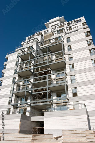 Photo: residential building construction site and blue sky residential building construction site and blue sky