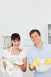 Lovers washing dishes together