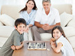 Photo: Portrait of a little family in their living room Portrait of a little family in their living room