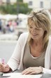 Woman Writing Postcards