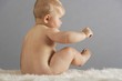 Baby Sitting on Fur Rug