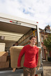 Photo: Moving Couple Carrying Sofa Moving Couple Carrying Sofa