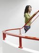 Young woman walking up stairs indoors