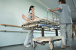 Nurses Moving Patient on gurney in hospital Corridor, low angle view