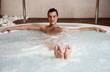 Young man in jacuzzi at a spa Young man in jacuzzi at a spa