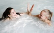 Two young woman in jacuzzi at a spa Two young woman in jacuzzi at a spa