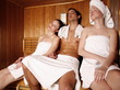 A man and two young women relaxing at a spa  together