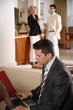 Bussinessman working on a laptop computer during meeting