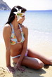 Young woman in bikini on beach