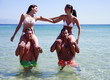 Group of friends playing in the water