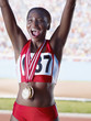 Athlete cheering with three medals around neck
