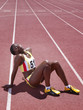 Racer sitting on a track with her head back
