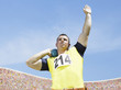Athlete shot putting in an arena