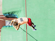 Athlete doing pole vault over a large mat