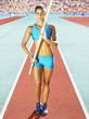Athlete pole vaulting in an arena