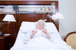 Senior woman taking pills
