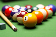 Photo: Billiard balls, cue on green table! Billiard balls, cue on green table!