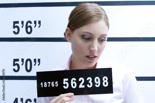 Photo: Young woman mugshot Young woman mugshot