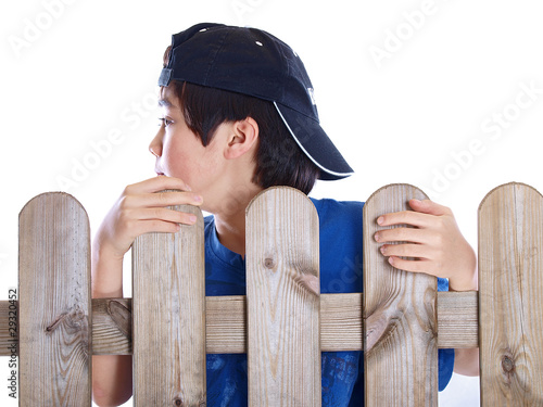 Photo: child behind the garden fence child behind the garden fence