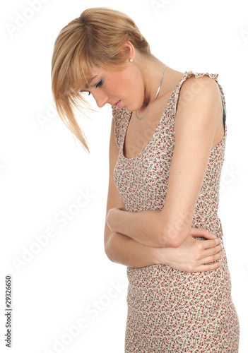 Photo: young woman suffering from pain of stomach young woman suffering from pain of stomach